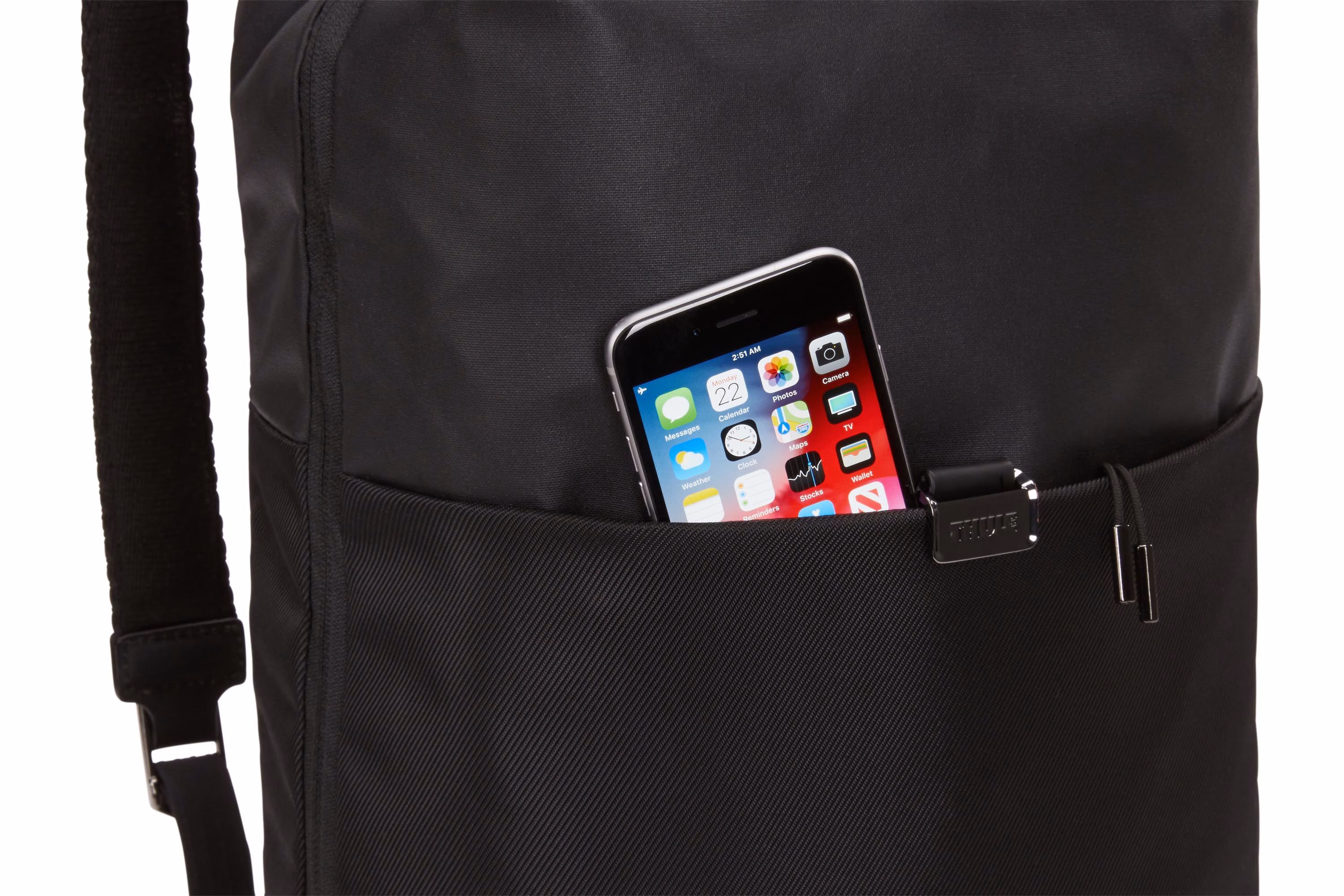 Cell phone in front zippered pocket of Thule Spira Backpack