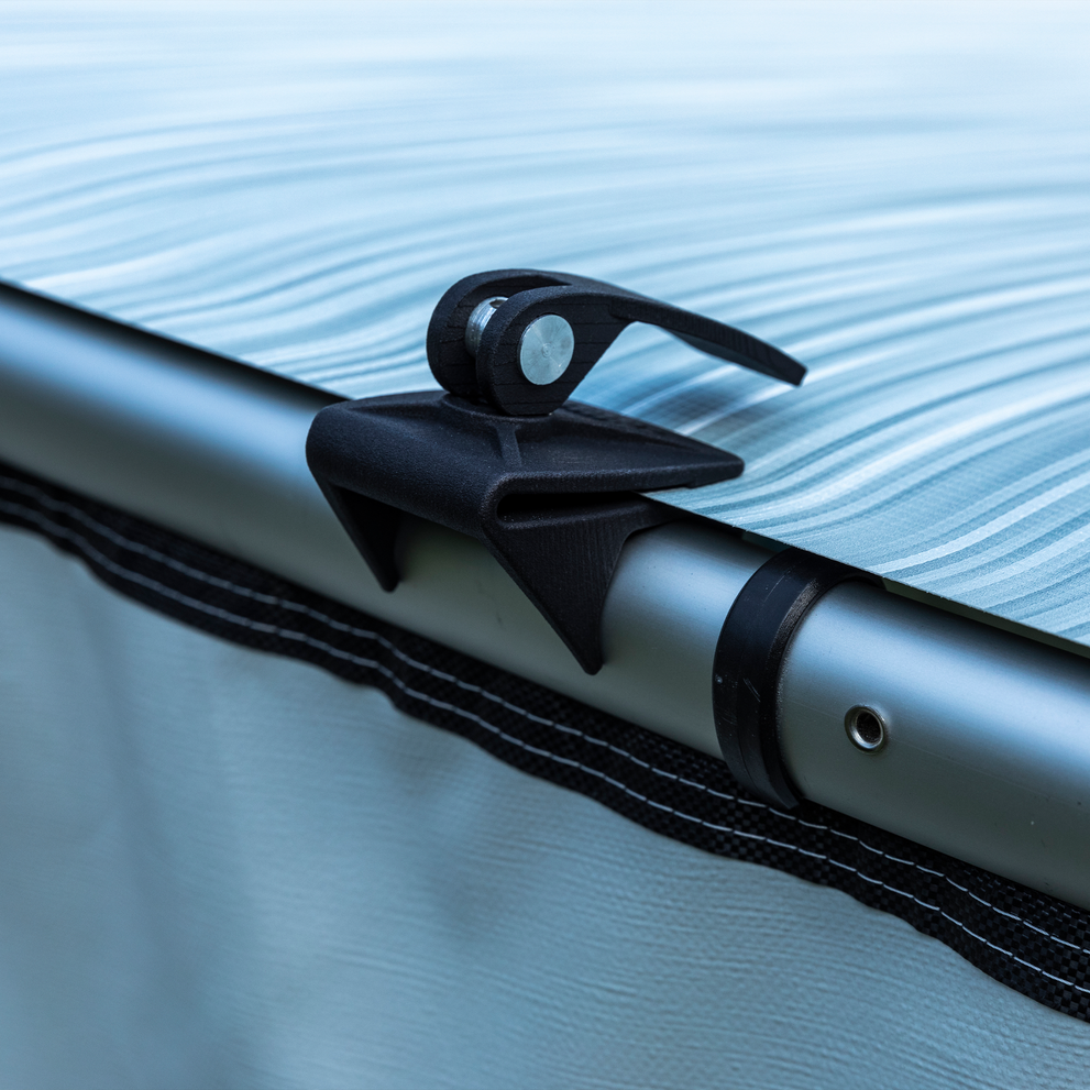A close-up of a Thule Fabric Clamps.