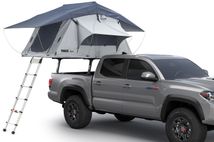 Thule Xsporter Pro Mid 500011 on truck with roof top tent