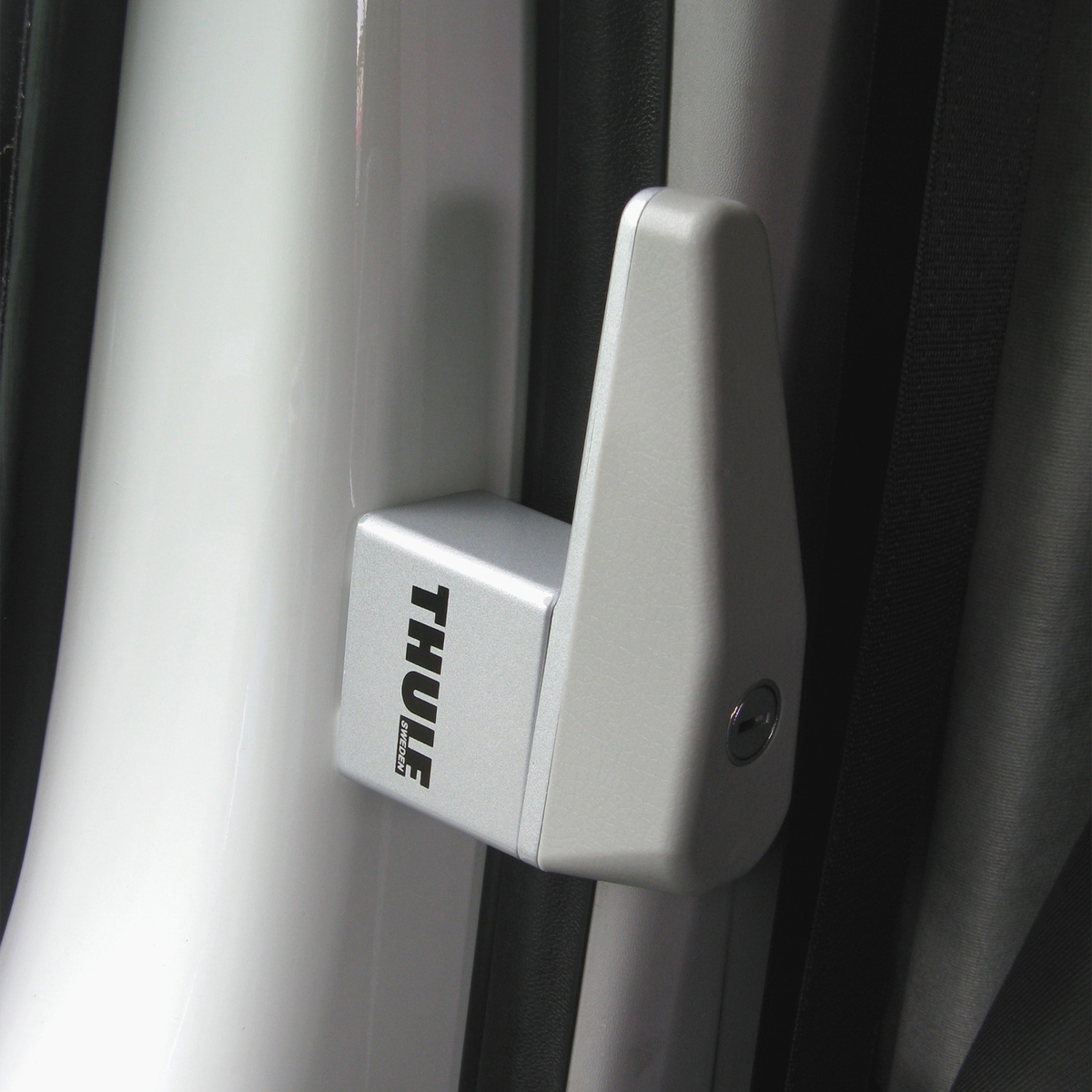 A white Thule Cab Lock inside a van.