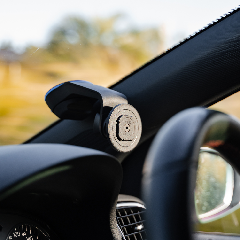 Quad Lock car mount attached to windshield.