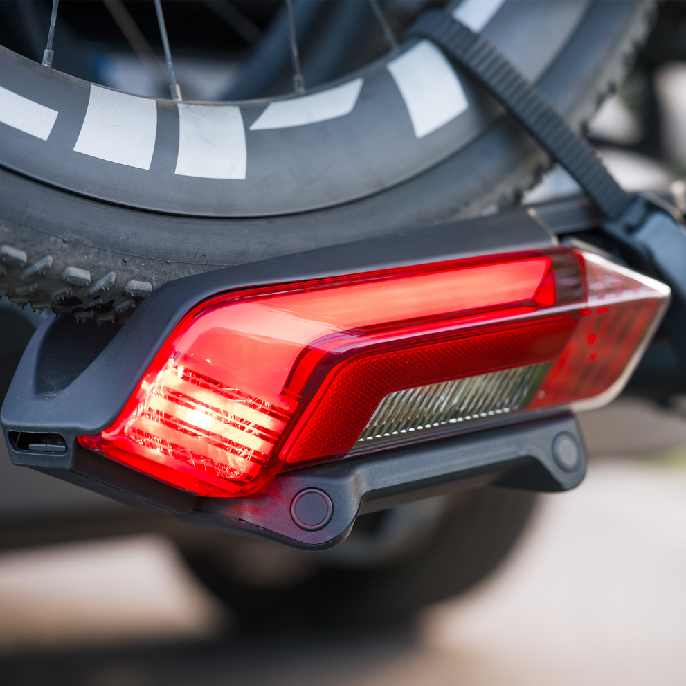 Close-up of a Thule Epos ParkSecure's integrated tail light with parking sensors.
