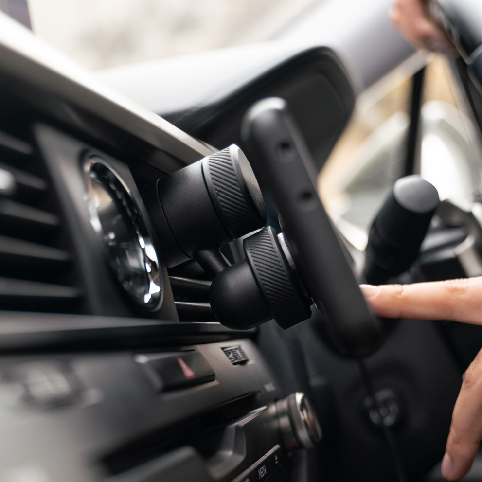 Phone mounted on Quad Lock vent car mount.