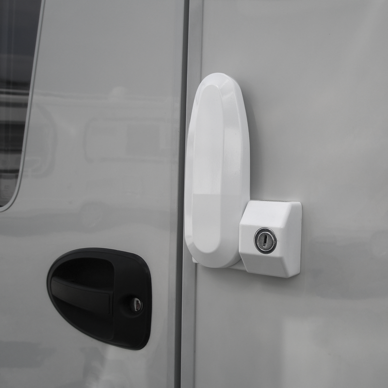A Thule Inside-Out Lock G2 caravan lock attached to the door of a caravan.