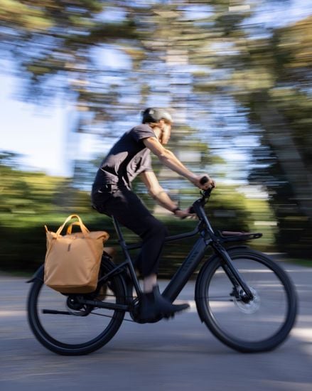 Thule Chasm tote with InLock 25L mounted on a bike while riding