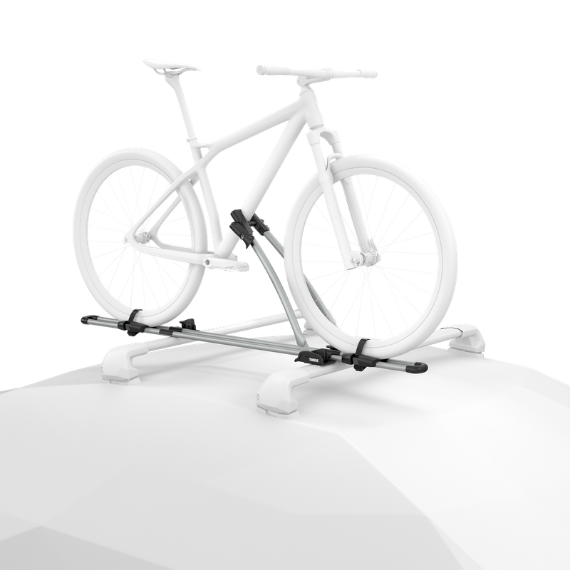 Ghosted illustration of a bicycle secured upright to an aluminum Thule FreeRide mounted on a vehicle roof.