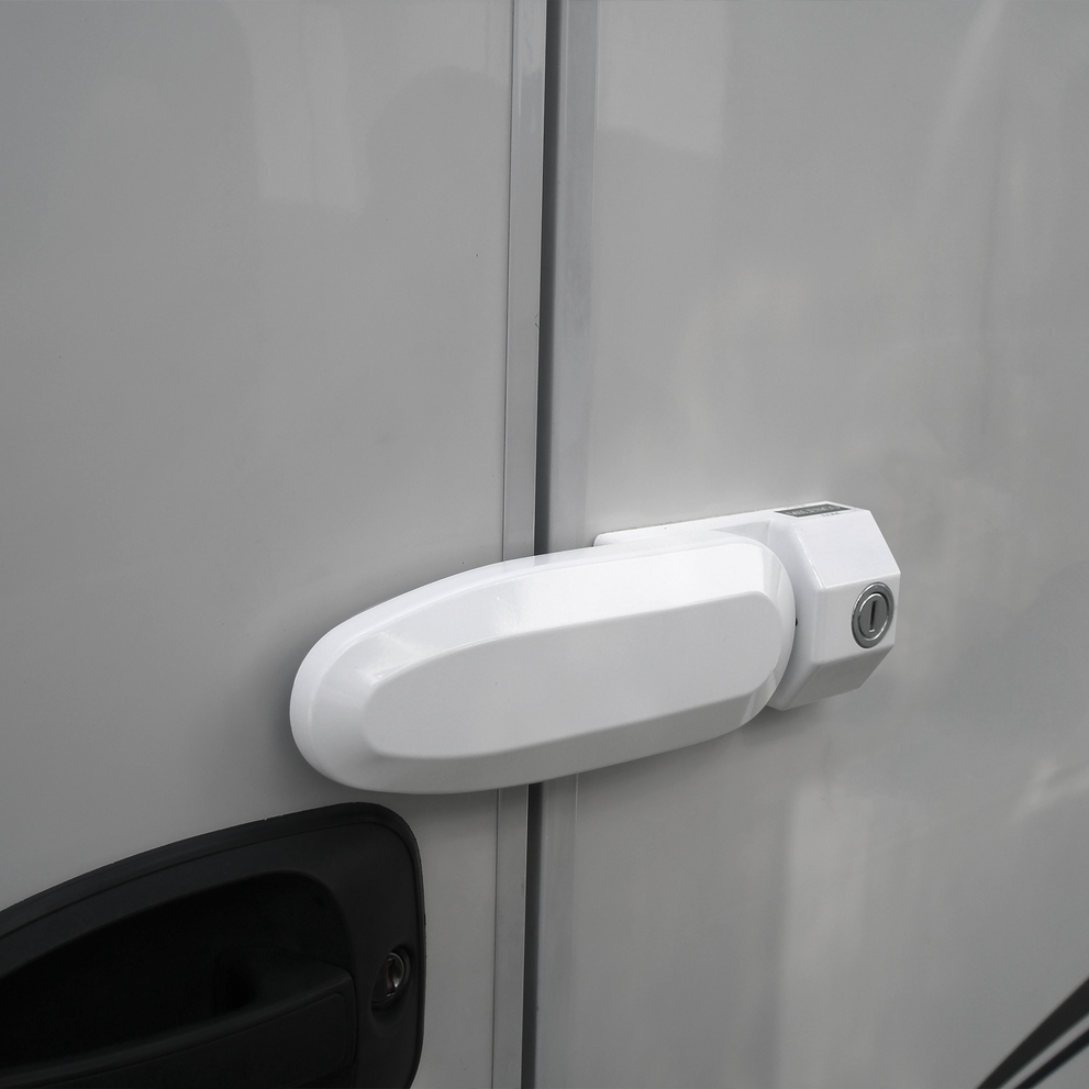 A Thule Inside-Out Lock G2 caravan lock attached to the door of a caravan.