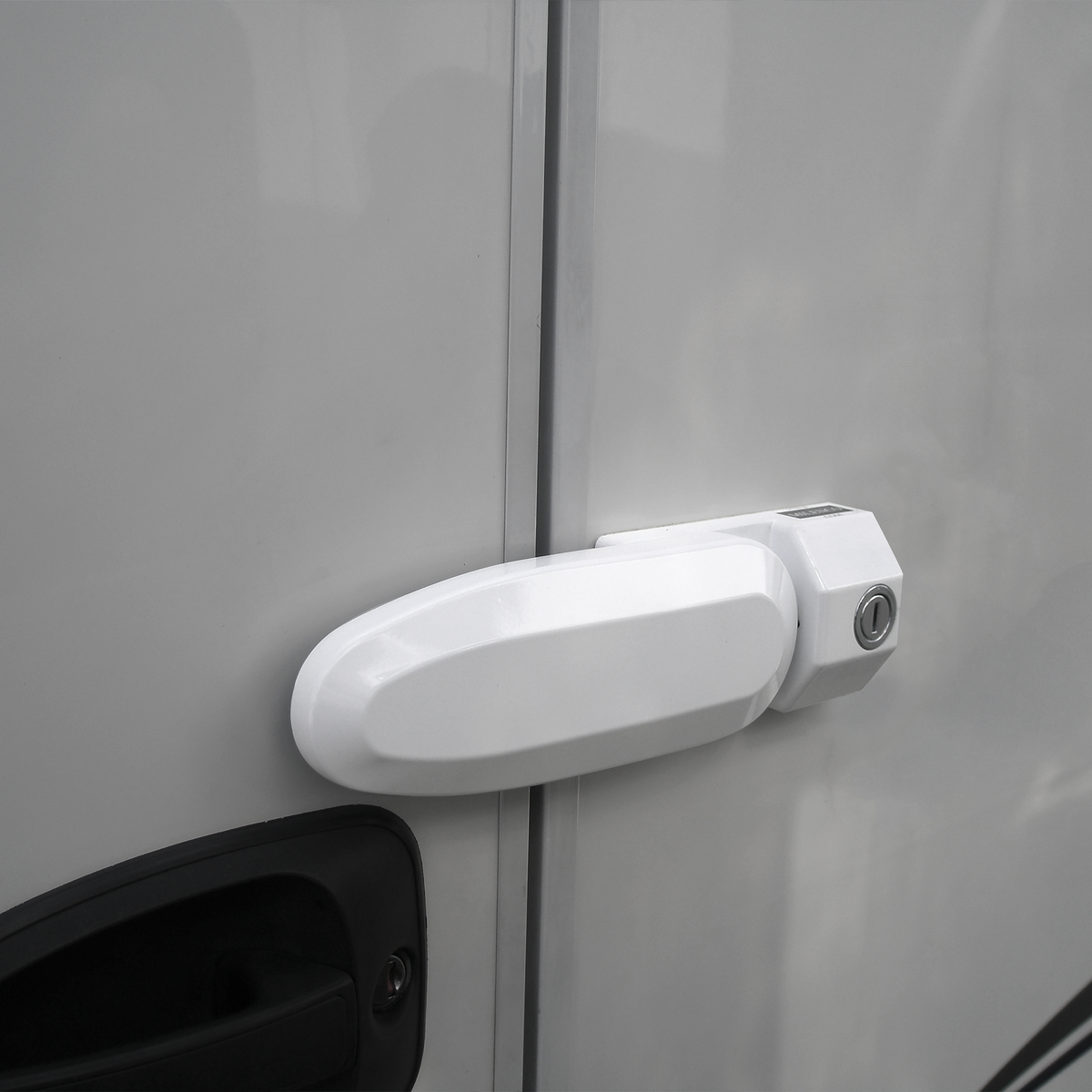 A Thule Inside-Out Lock G2 caravan lock attached to the door of a caravan.