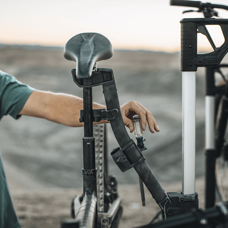 A close up of the bike repair holder on the Thule Verse hitch bike rack.