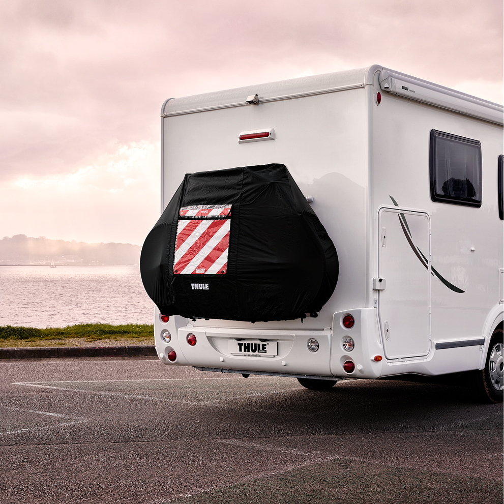 A Thule Bike Cover attached to a white motorhome.