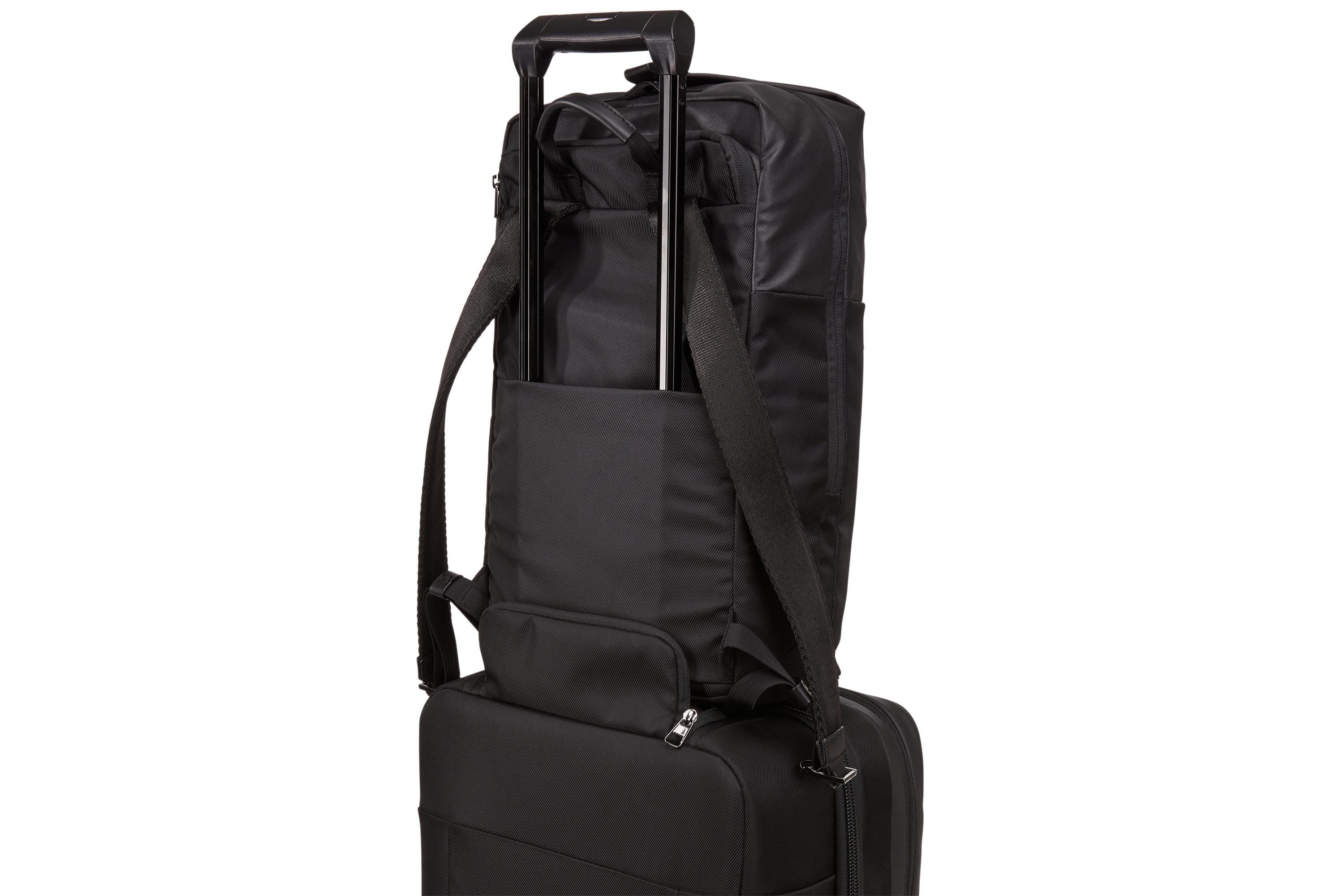Thule Spira Backpack attached to rolling luggage thanks to pass-through panel