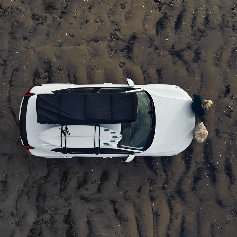 Birds eye view of a car with a roof top tent