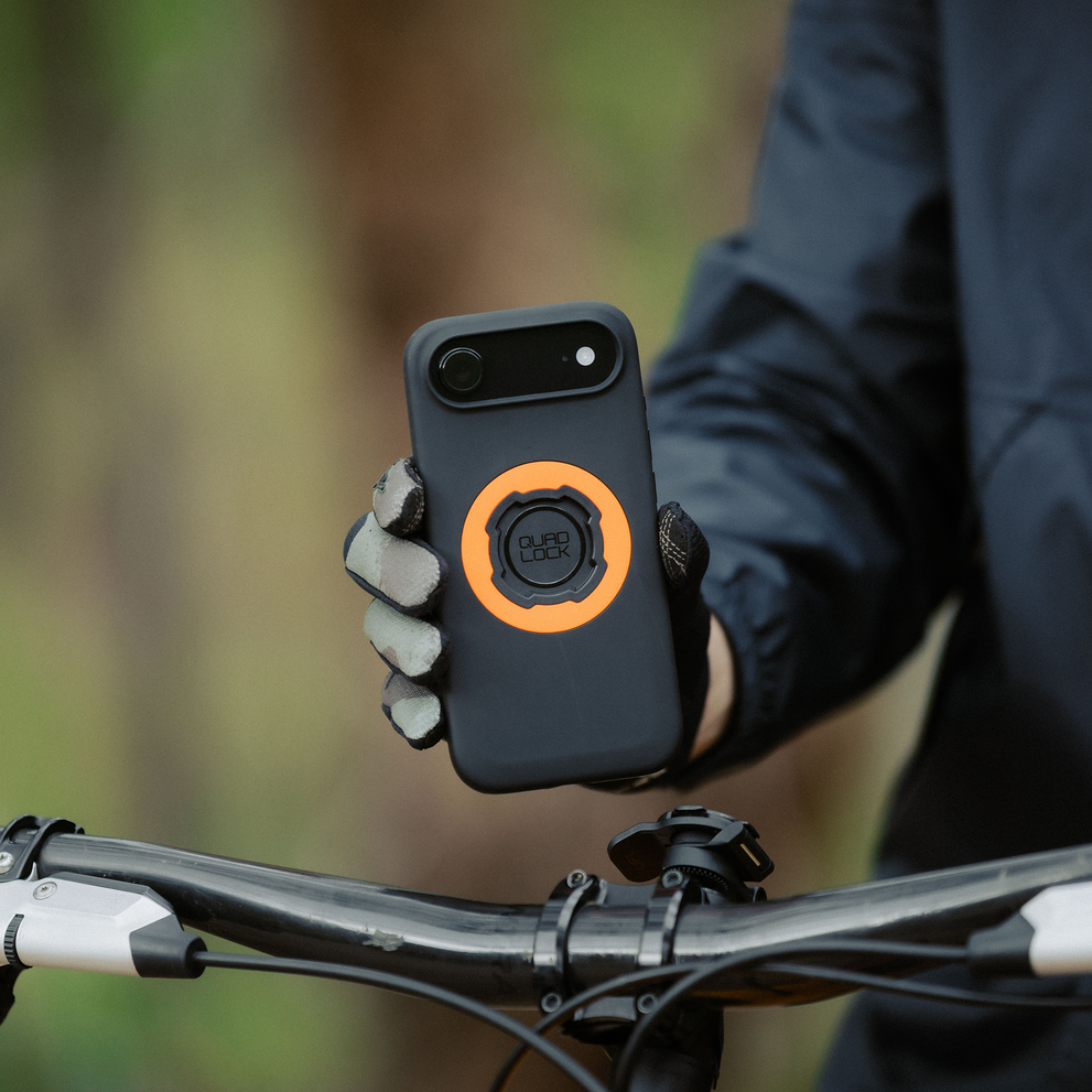 Quad Lock MAG iPhone case above bike handlebar.