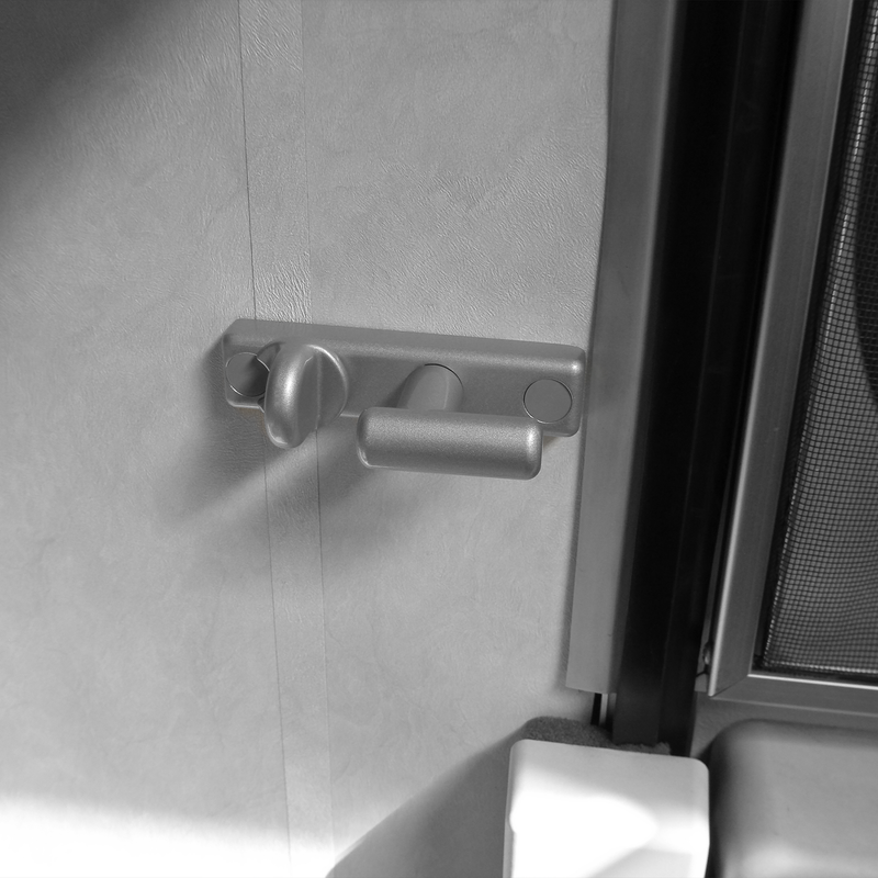 A Thule Inside-Out Lock G2 caravan lock attached to the door of a caravan.