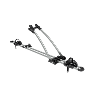 Thule FreeRide bicycle roof rack in aluminum, shown at an angle with the frame holder raised.