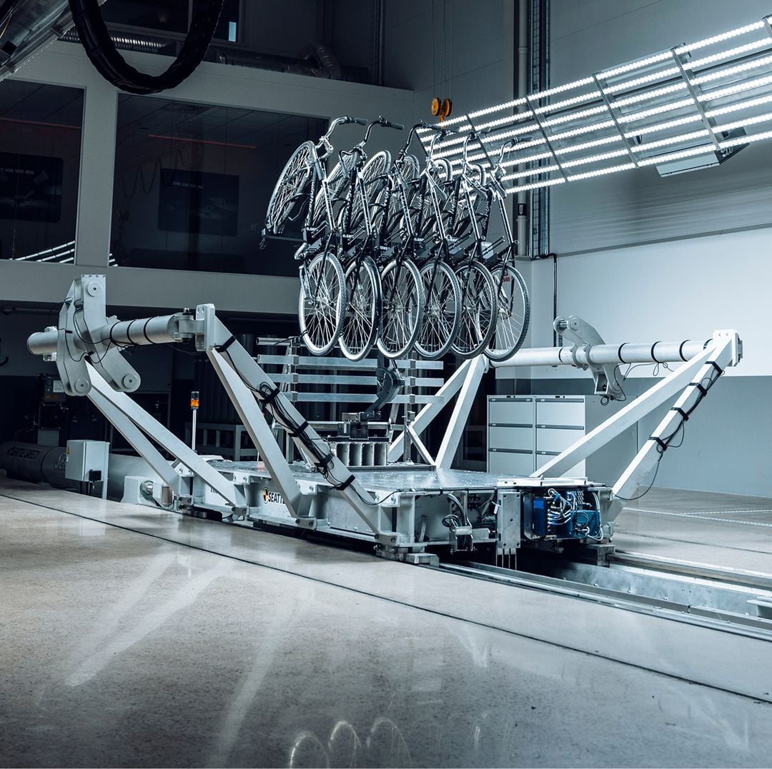 6 bikes are mounted on a Thule bike rack while undergoing testing on a sled at the Thule Test Center. 