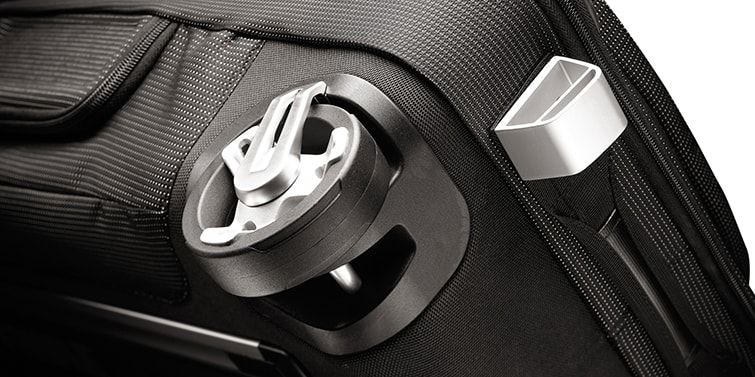 A close-up of the wheels on a Thule duffel bag with wheels with a white background.