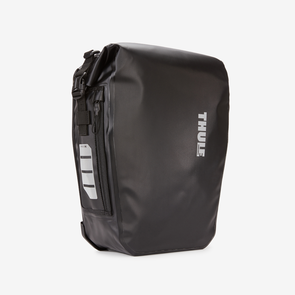 Black bike bag with a gray background.