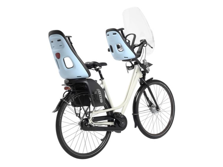 A picture of a bike and two child bike seats with a white background.