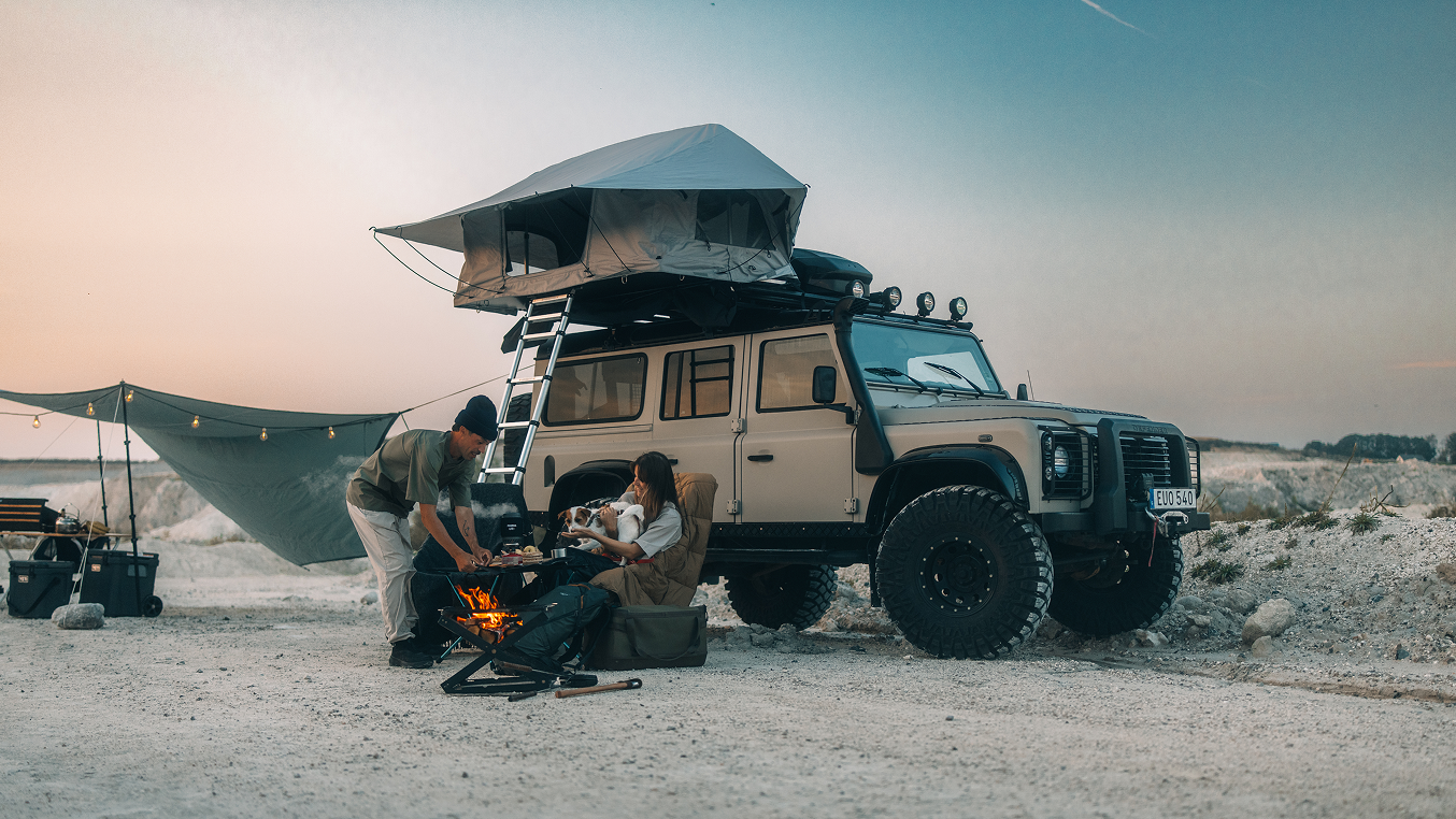 Thule rooftop tent set up on an off road vehicle at sunset