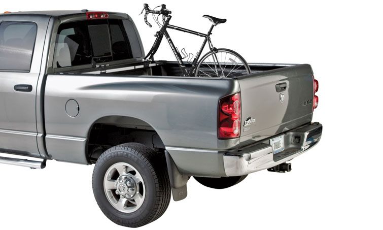 A Thule Bed Rider fork mount truck bed bike rack carrying one bike.