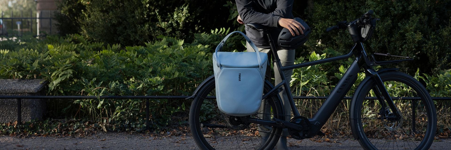 A Thule pannier mounted on an e-bike using the InLock system by Thule, designed for fast, secure attachment and everyday bike commuting.