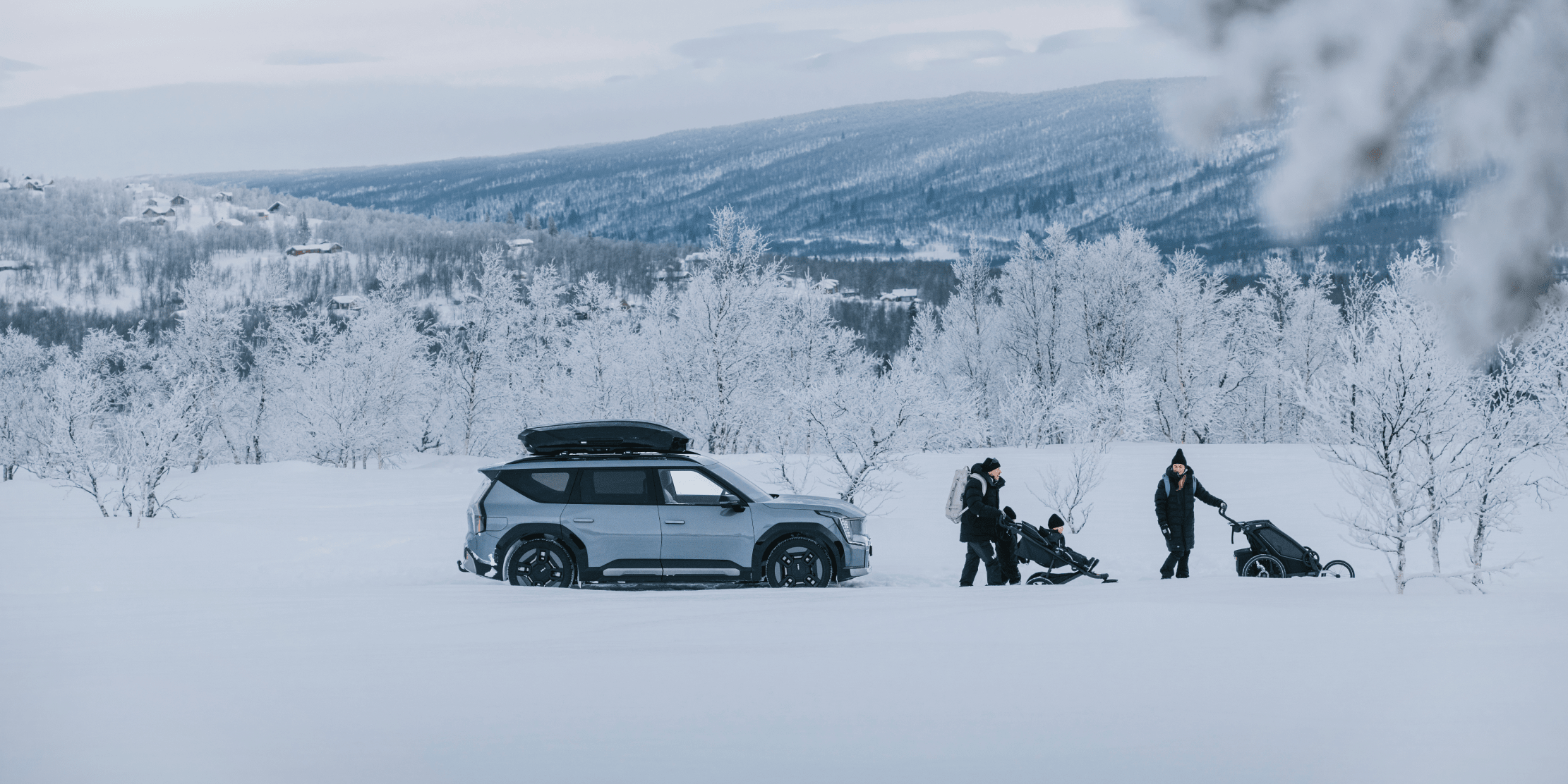 Car and people in snow landscape