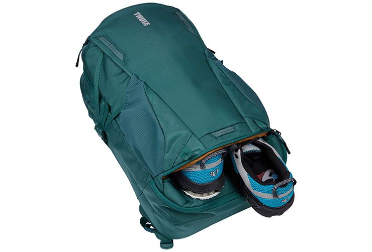 Shoe compartment in a thule backpack is perfect for a workout day.