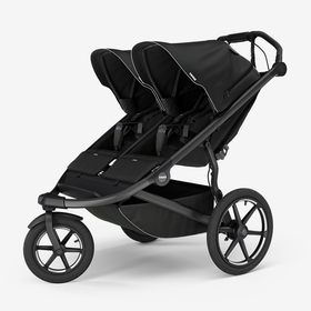 A double jogging stroller that is black with a gray background. 