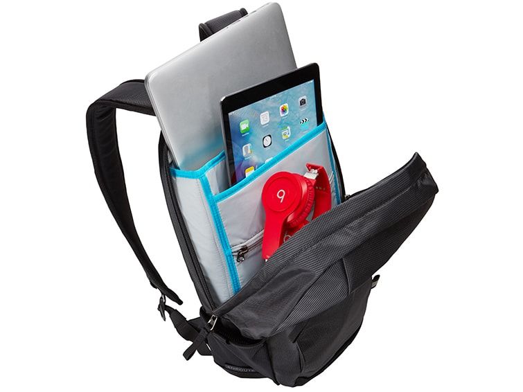 A close-up of one of the laptop backpacks with an open pocket to reveal a laptop and tablet.