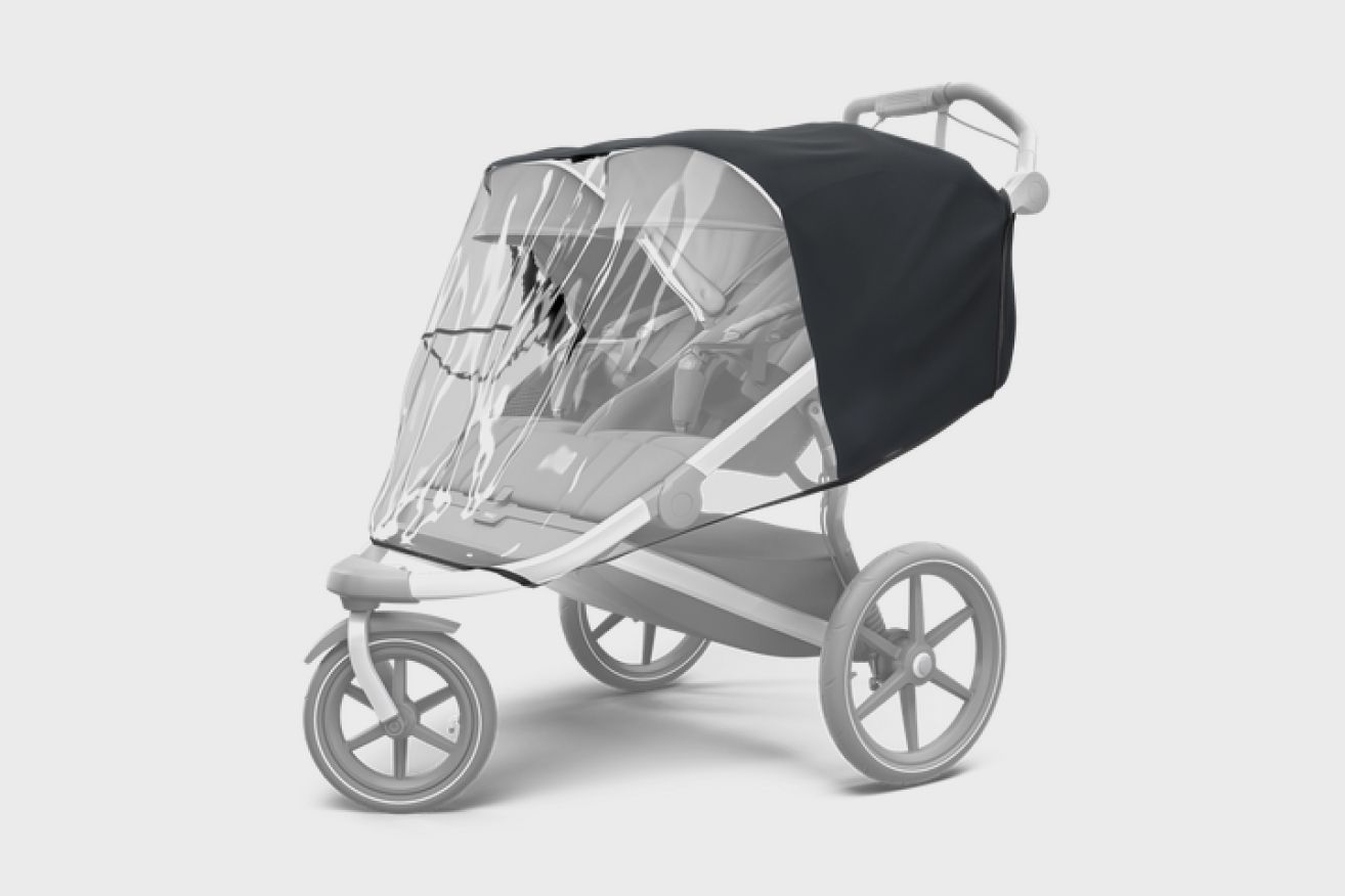 A picture of the Thule double stroller with the best stroller accessory for weather protection.