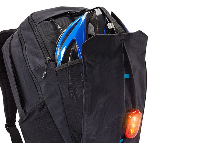 A bike helmet compartment in a Thule bike commuter backpack.