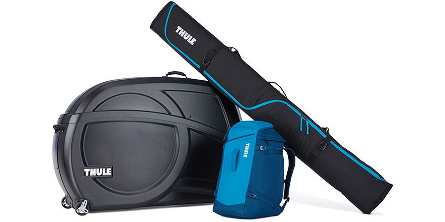 Thule RoundTrip hard bike travel case, ski bag and ski boot backpack with a white background. 