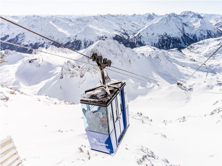 A ski lift at Valluga in St Anton looks over the snowy peaks.
