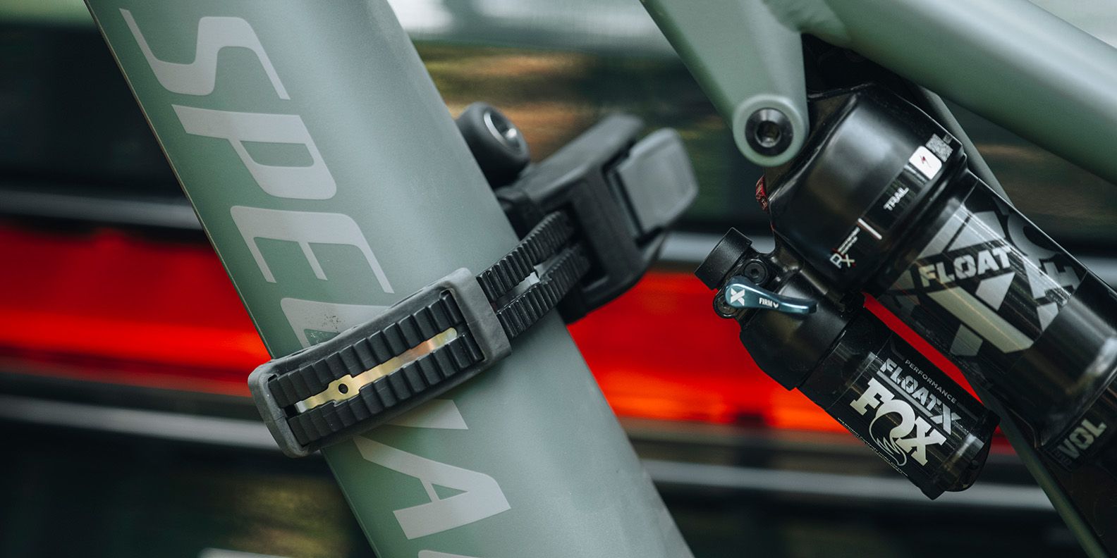 A close up of a strap on the Thule Epos bike rack wrapped around a bike frame