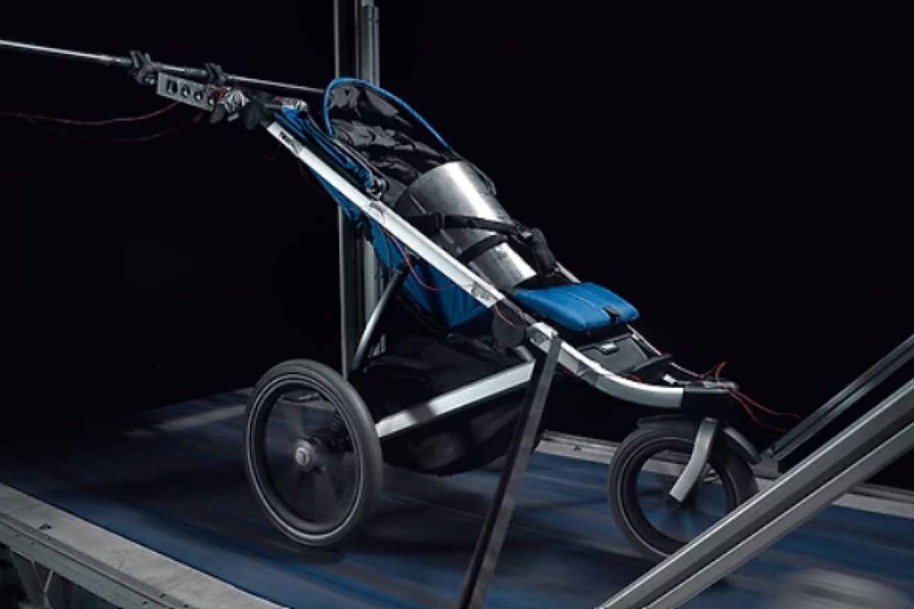 A Thule jogging stroller being tested in the Thule test center on a durability test.