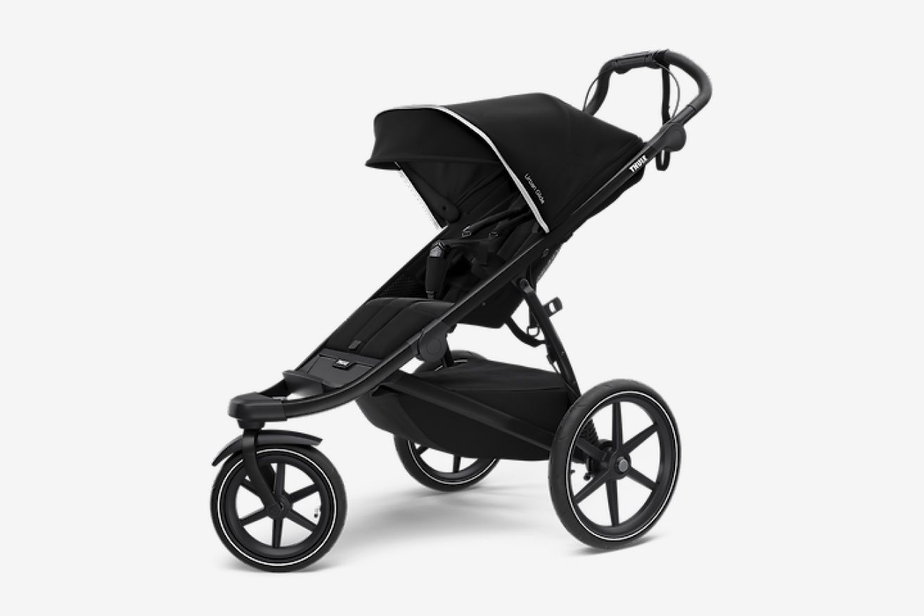A black Thule running stroller with a gray background.
