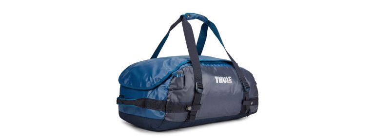 The blue Thule Chasm duffel with a white background.