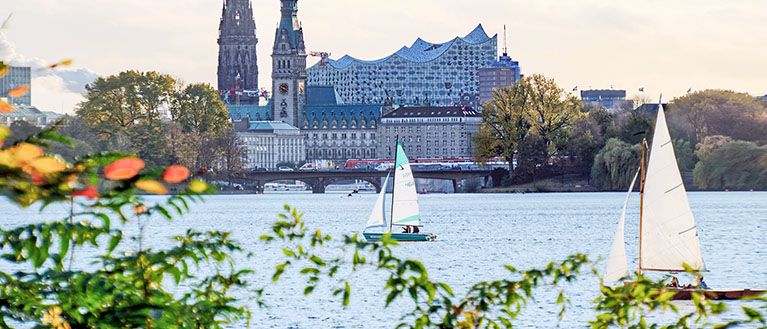 An image of the Hamburg skyline with the river, church and concert hall.