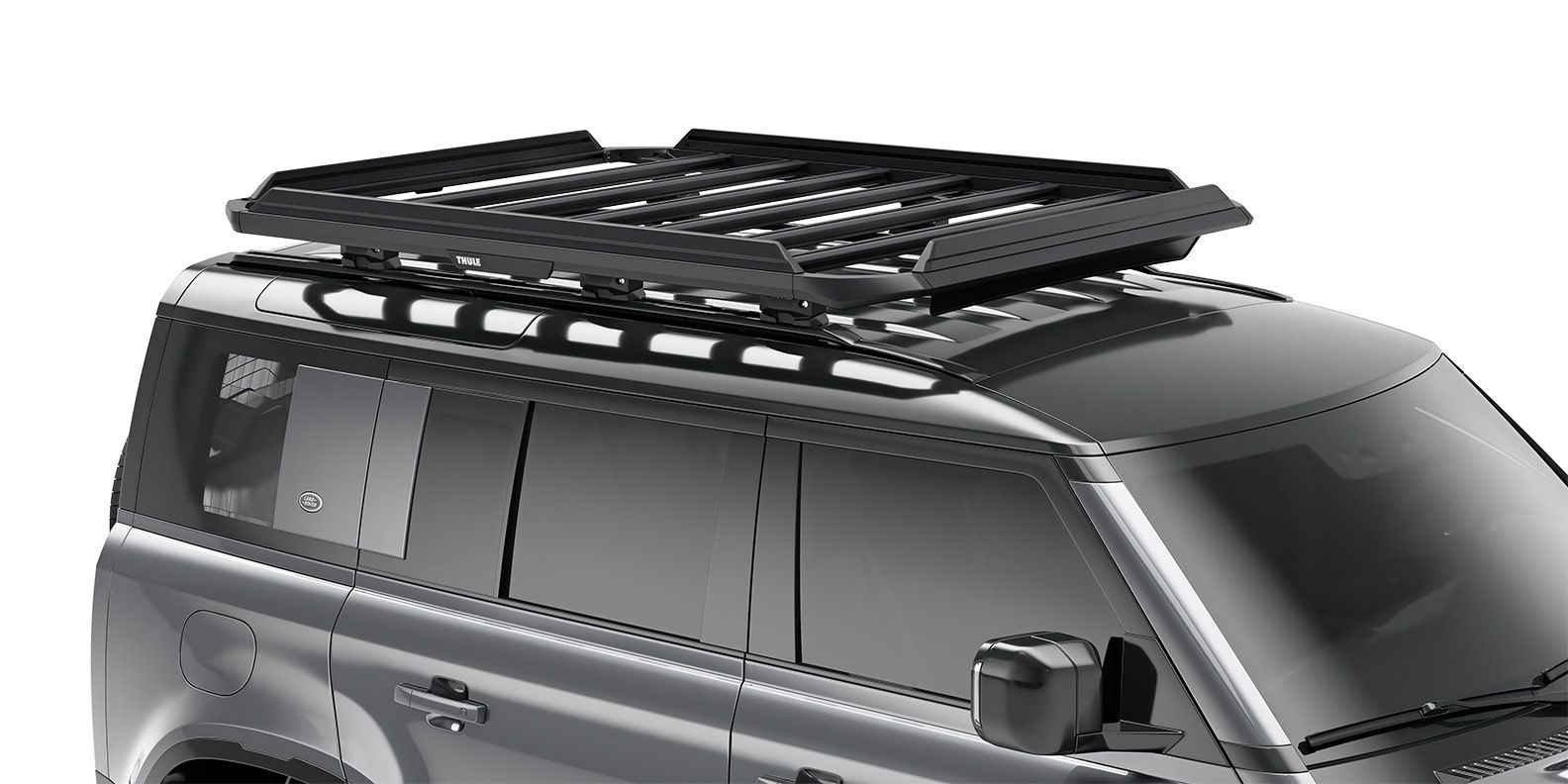 Thule Caprock railing kit mounted on the roof of a car, with a white background. 