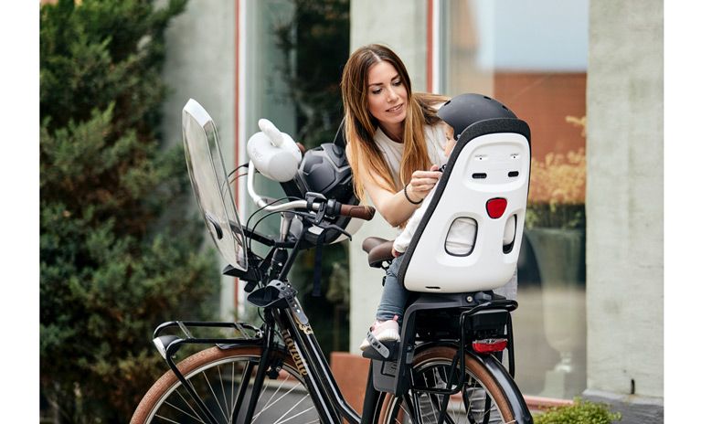 At what age can my child start using a Thule child bike seat?